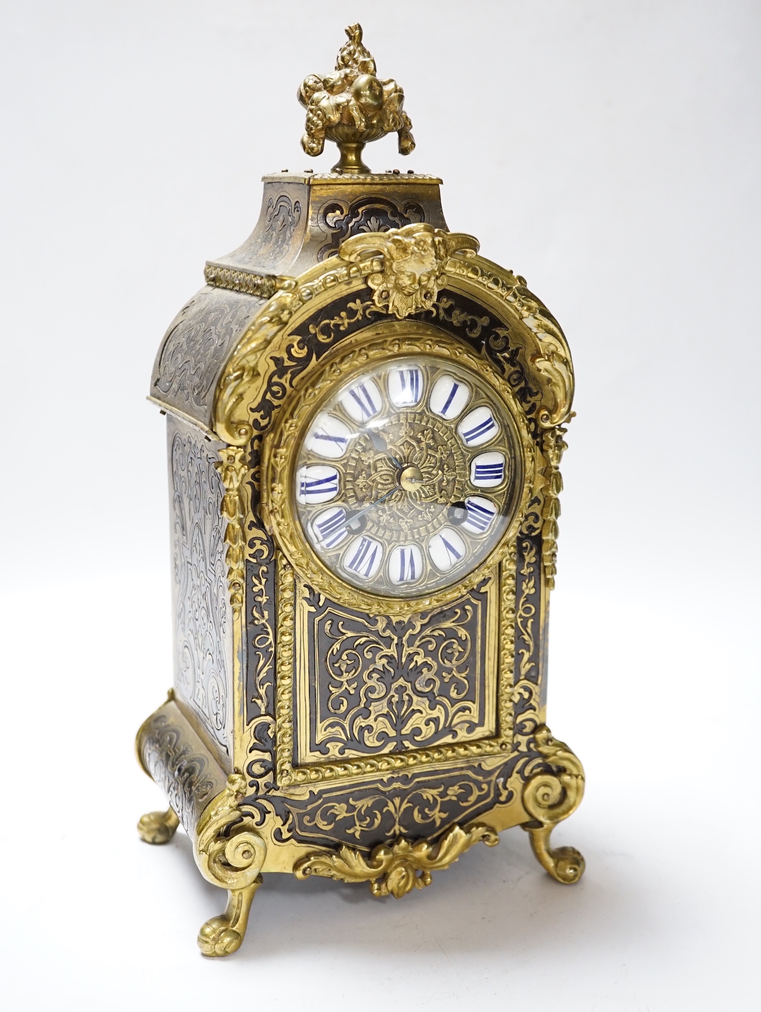 A late 19th century French cut brass inlaid mantel clock, 32cm high